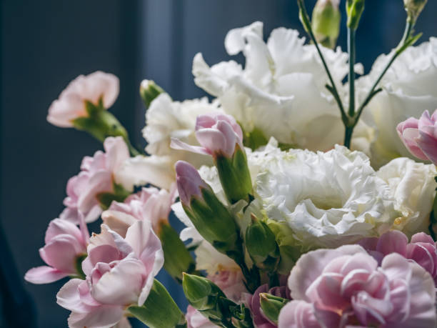 istock Bouquet of white eustomas and pink carnations close-up 2161458225