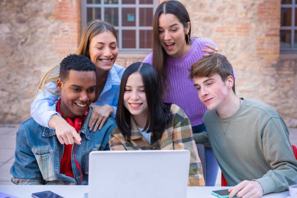 istock Group of students, prepare for university exams, use a laptop. 2161458740