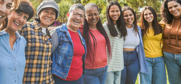 istock Multi generational women smiling in front of camera - Female multiracial group having fun togheter outdoor - Main focus on woman face with glasses 2161459588
