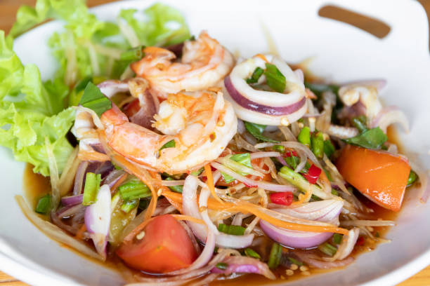 Spicy mixed seafood salad. (Yum Ta-Lay) stock photo