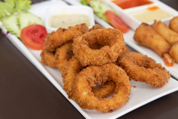 istock Salt and pepper squid deep-fried or Calamari on a white plate. 2161462034