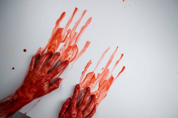 istock Female hands in blood on a white background. 2161462901