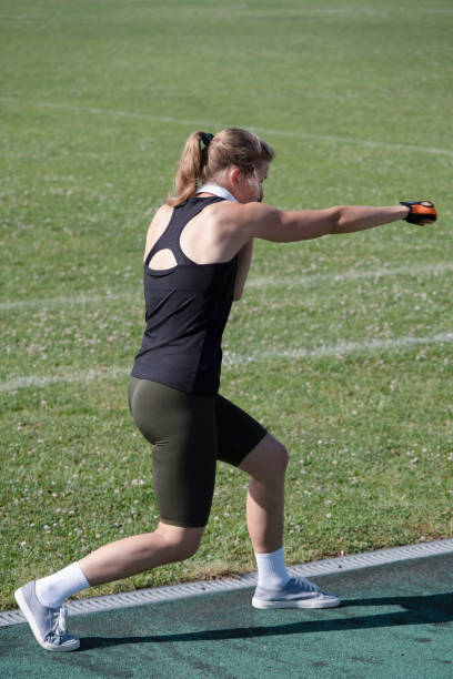 Portrait of Young Athlete with Visual Impairment Sprinting on Outdoor Track with Determination