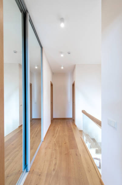 istock Home Second Floor Hall. Interior. Wooden Brown Flooring, Stairs. LED Light. Mirror 2161465046