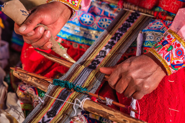 istock Peruvian woman weaving near Colca Canyon, Peru 2161465971