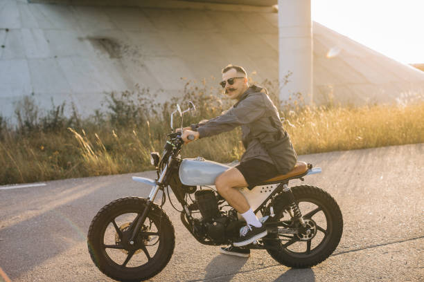 istock A young male biker rides a motorcycle on a sunny summer day. 2161467518