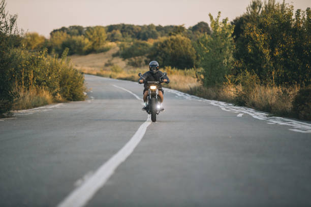 istock A biker rides a cafe racer on the highway 2161467631