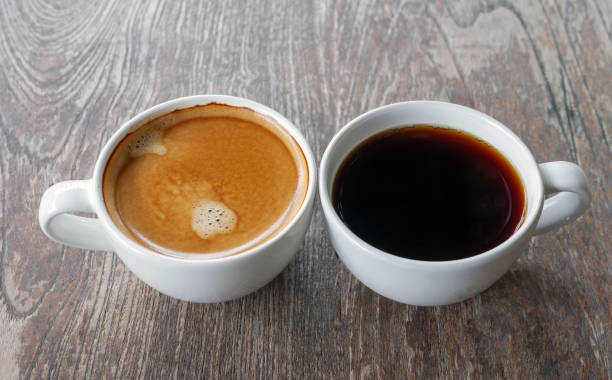 istock Two coffee cup, Americano coffee and espresso coffee on wooden table 2161469110
