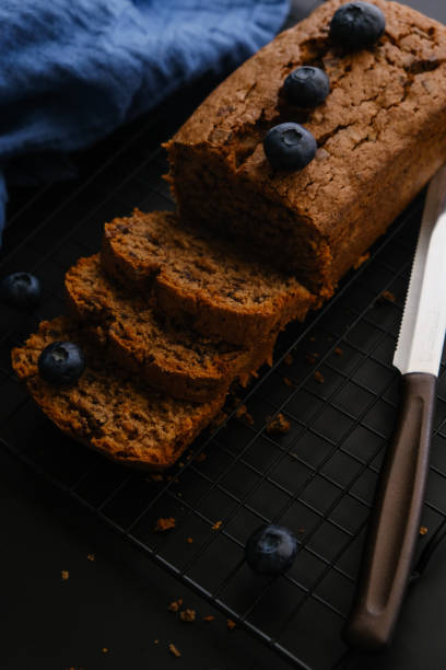 istock Chocolate cake with blueberries on the black background 2161471100
