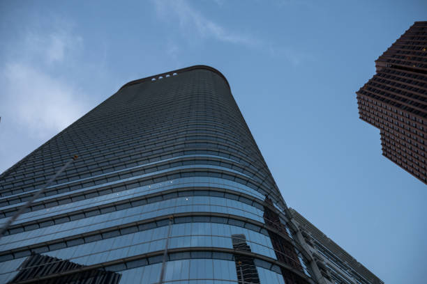 Low angle of  blue glass skyscraper in Downtown Houston Texas