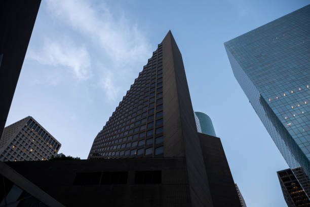 Low angle shot of modern geometric shapes of skyscrapers against the sky in Downtown Houston Texas