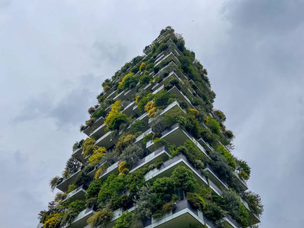 Milan, Italy - April 27, 2024: Bosco Verticale residential skyscraper in Porta Nuova district on moody spring day. Vertical greenery