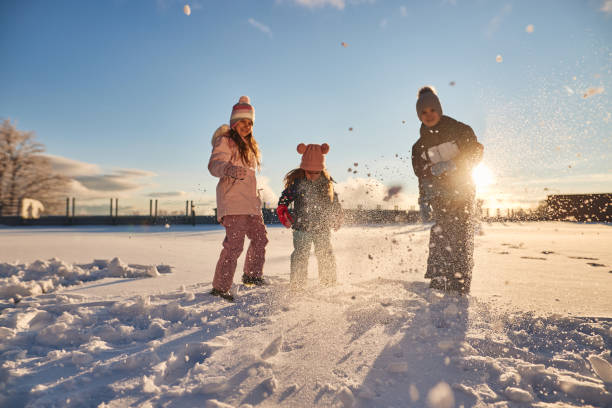 istock Happy kids enjoying winter snow 2161473660