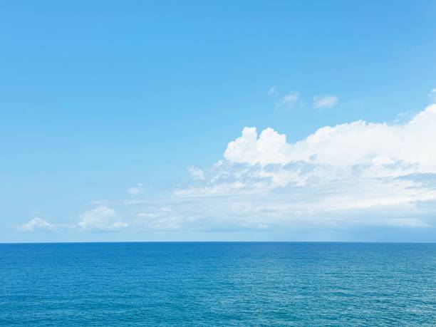 istock Beautiful white cloud above calm blue sea 2161475084