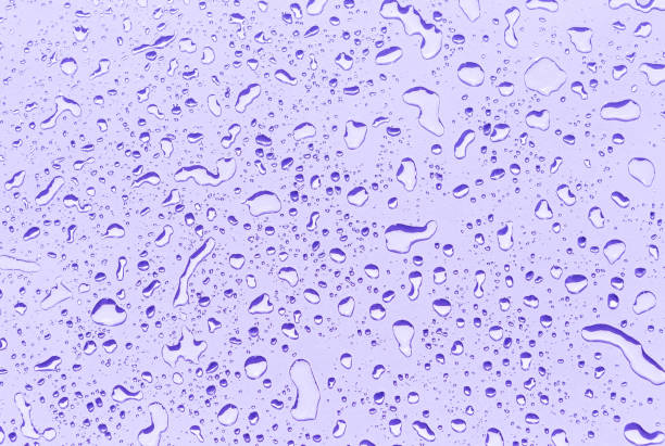 istock Water drops on purple background 2161475591