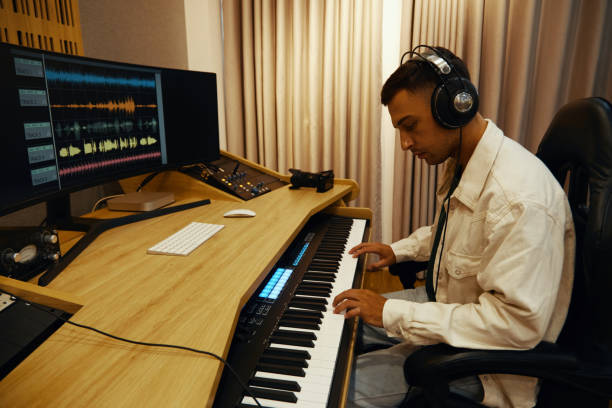 istock Musician Playing On Synthesizer To Record Song 2161477645