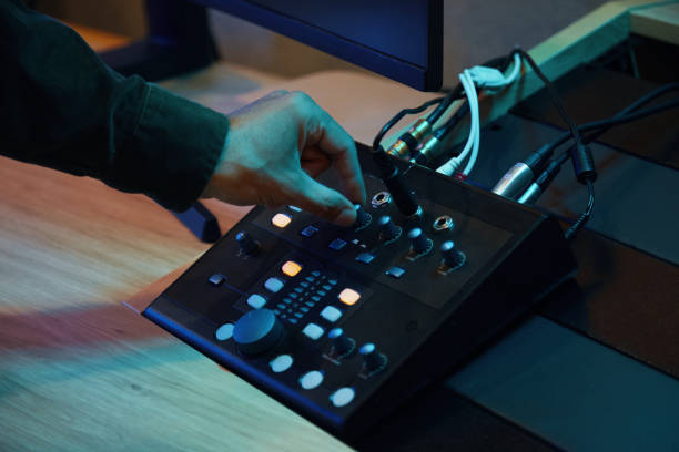 istock Musician Turning On The Sound On Control Panel 2161477855