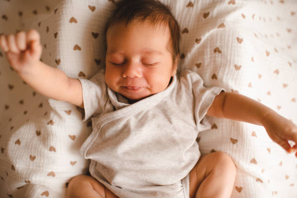 istock Baby boy in bed at home 2161478122