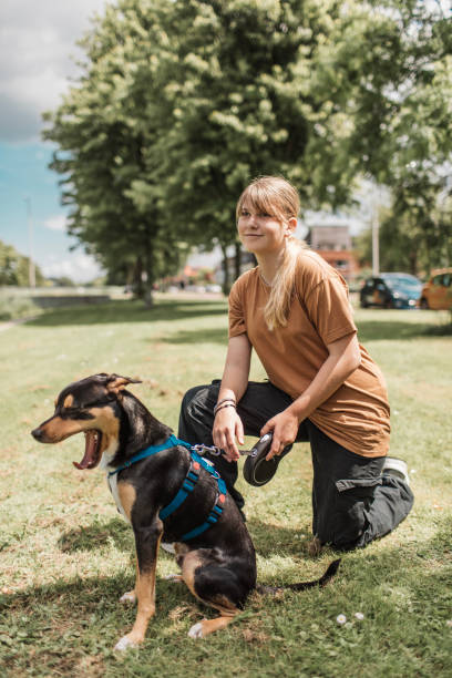 istock Young girl and her puppy 2161480255