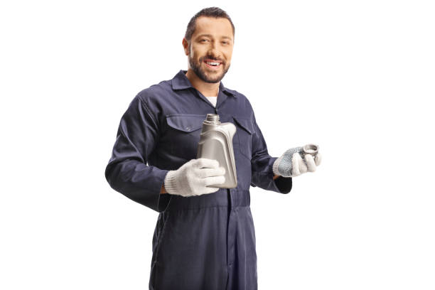 istock Car mechanic holding engine oil 2161480492