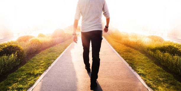 istock Low section of a man walking in the park 2161481728