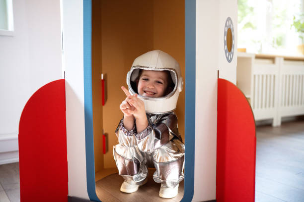 istock Preschool boy in a space suit playing at home, imagining space travel. 2161482041
