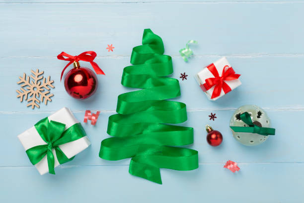 istock Creative handmade christmas tree with decor on wooden background, top, view 2161483805