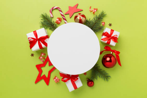 istock Greeting card mockup with christmas decor on color background, top view 2161483810