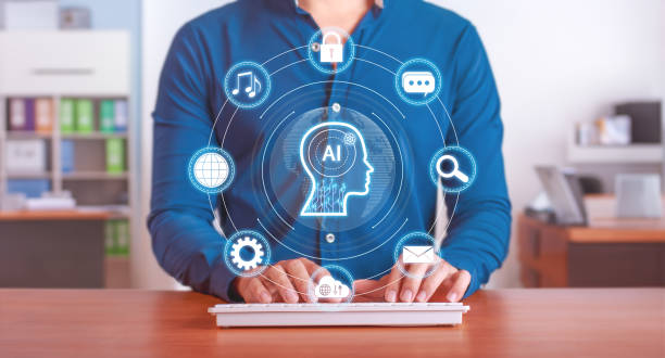 istock AI-enhanced workflow solutions for everyday tasks. Man using laptop with AI icons and virtual interface. Boost productivity and efficiency with artificial intelligence technology 2161485563