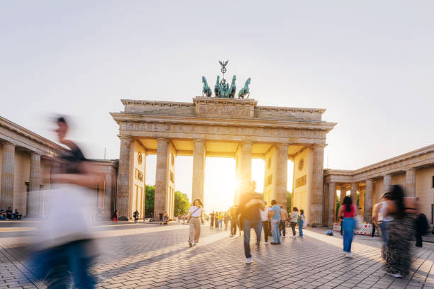 istock Sunset Glow at Brandenburg Gate in Berlin, Tourists Walking 2161490444