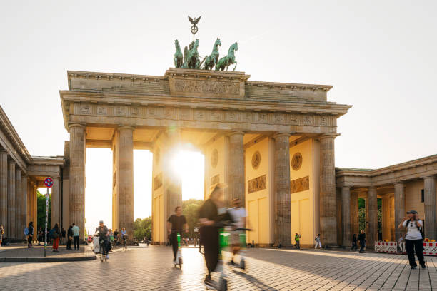 istock Sunset Glow at Brandenburg Gate in Berlin, Tourists Walking 2161490530