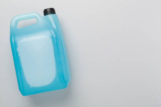 istock Can with antifreeze on color background, top view 2161491374