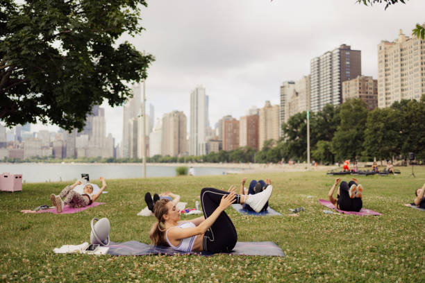 istock People practicing yoga outdoors 2161493662