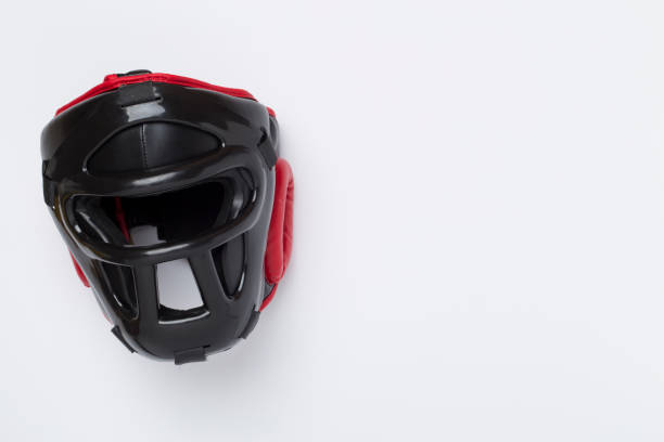 istock Black leather boxing helmet on color background, top view. 2161493725