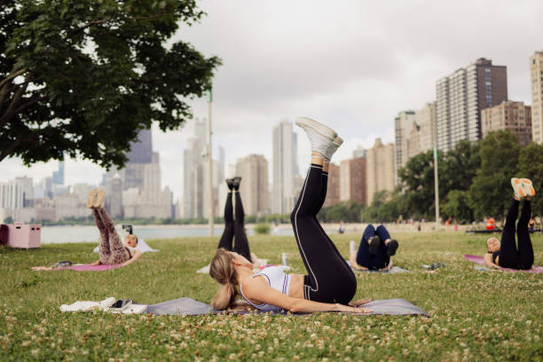 istock People practicing yoga outdoors 2161493983