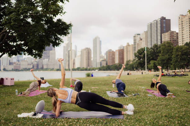 istock People practicing yoga outdoors 2161494010