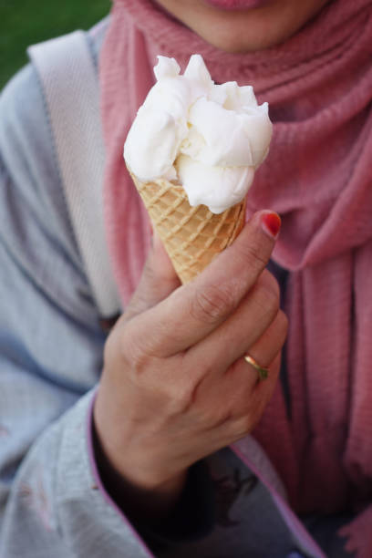 Close-Up Of Hands Holding Ice Cream Cones