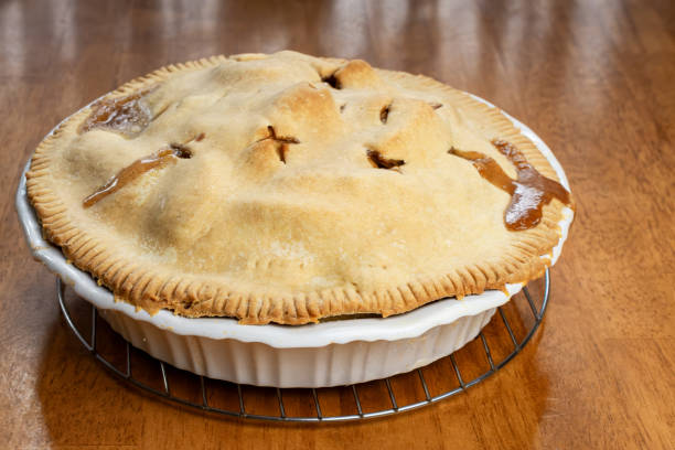 istock Making a pie:  Completed pie on the wooden table. 2161496196