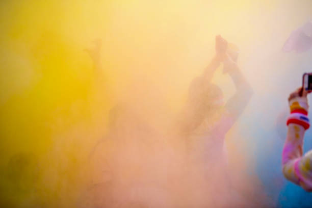 Young girl dancing in colorful  atmosphere