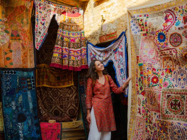 istock Woman choosing traditional textile while walking in Jaisalmer old town, India 2161497701
