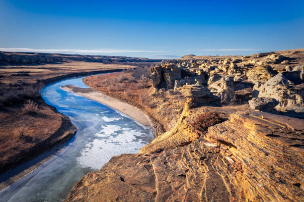 istock Frozen river winding through a canyon on a sunny day 2161498631