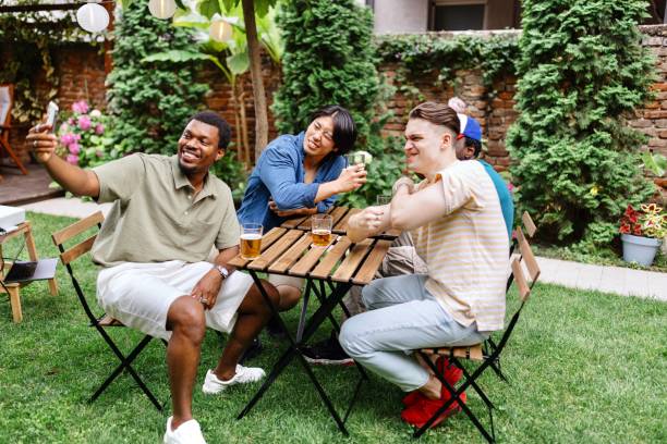 istock Friends talking with their teammate on a video call 2161499871