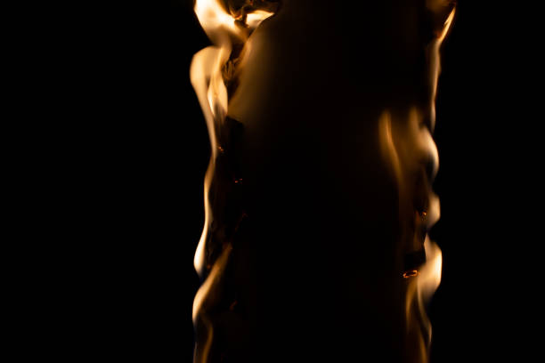 burning paper, glowing edge of paper on a black background