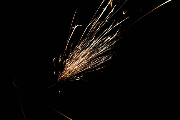 sparks from the grinder glowing in the dark