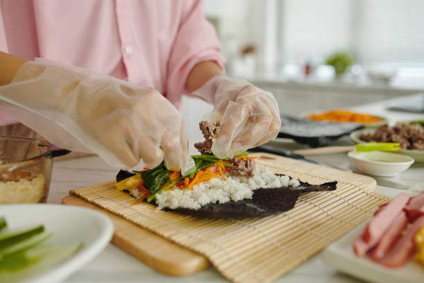 istock Woman Putting Ingredients For Roll 2161503034