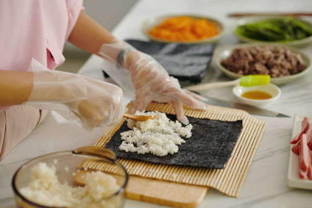 istock Woman Making Korean Kimbap At Home 2161503093