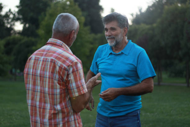 istock Two mature men talking about work in nature 2161504648
