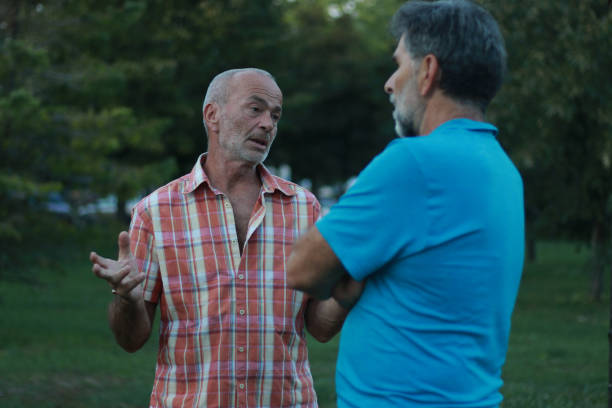 istock Two mature men talking about work in nature 2161504678