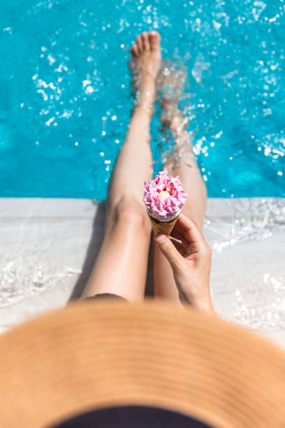 istock Relaxing by the pool with an ice cream cone 2161505653