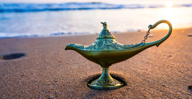 Aladdin magic lamp on the beach shore